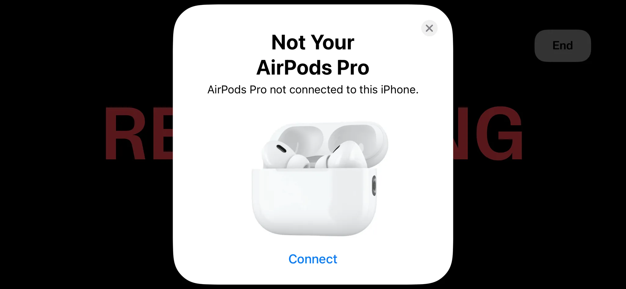 Wyskakujące okno z cudzymi AirPodsami na ekranie.webp